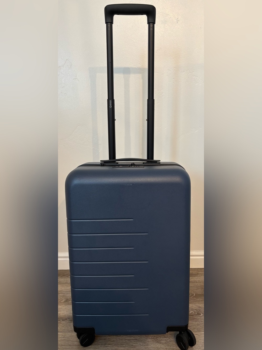 Quince Carry-On Suitcase Color: Navy Blue